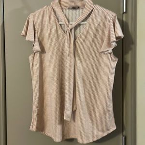 Five dollar sale. Polkadot, pink shirt with a tie detail.